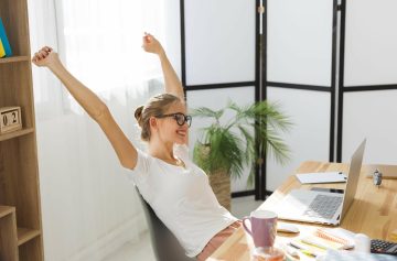 side-view-happy-woman-working-home (1)